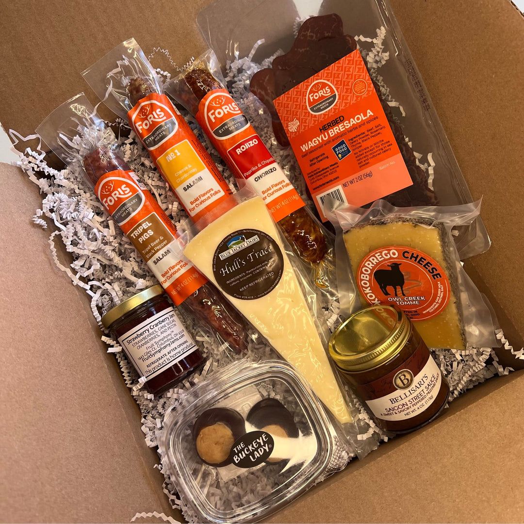 Foris Meats Buckeye Charcuterie Collection with gourmet salamis and bresaola, locally sourced cheese, mustard, and jam, along with Ohio made buckeyes.