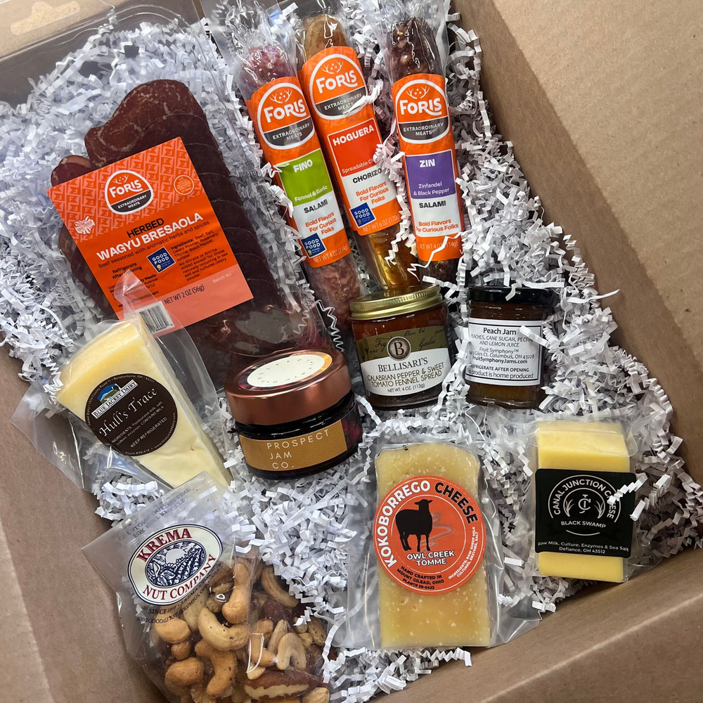 Foris Meats Deluxe Charcuterie includes 1 package Herbed Wagyu Bresaola, 1 link Hoguera Spreadable Chorizo, 1 link Fino Salami, 1 link Zin Salami, ¼ lb. wedge Hull's Trace Cheddar Cheese, ¼ lb. wedge Owl Creek Tomme, ¼ lb. wedge Black Swap Gouda, 1 jar Jam, 1 jar Calabrian Pepper & Sweet Tomato Fennel Spread, 7 oz. bag Gourmet Mixed Nuts