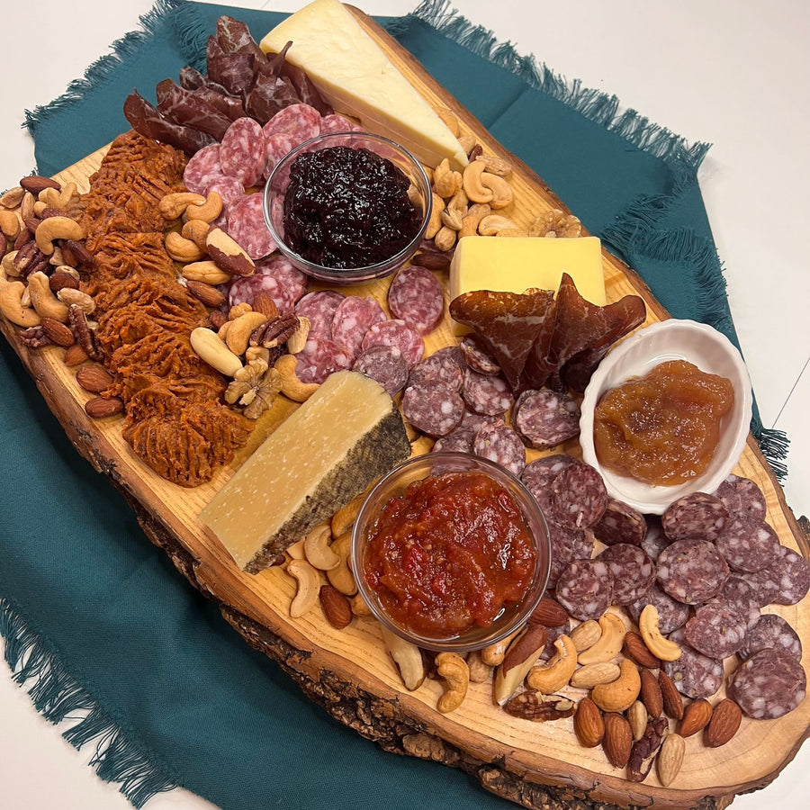 Foris Meats Deluxe Charcuterie includes 1 package Herbed Wagyu Bresaola, 1 link Hoguera Spreadable Chorizo, 1 link Fino Salami, 1 link Zin Salami, ¼ lb. wedge Hull's Trace Cheddar Cheese, ¼ lb. wedge Owl Creek Tomme, ¼ lb. wedge Black Swap Gouda, 1 jar Jam, 1 jar Calabrian Pepper & Sweet Tomato Fennel Spread, 7 oz. bag Gourmet Mixed Nuts