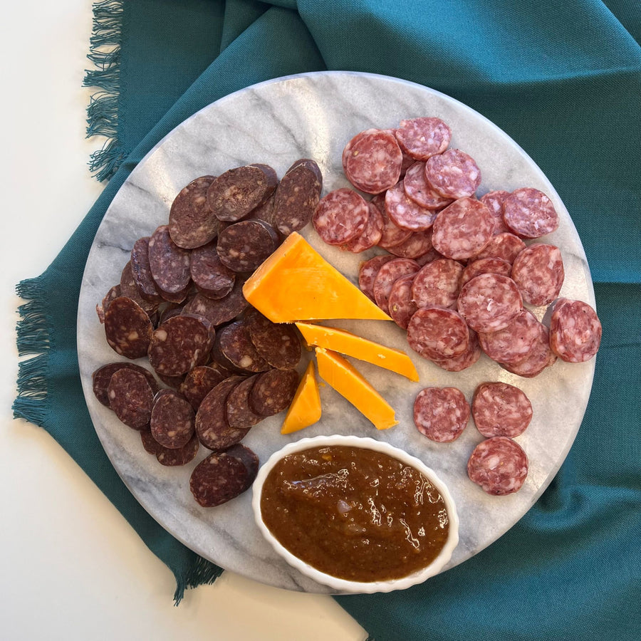 Beer Lovers Charcuterie Kit, featuring 2 of our fan-favorite salamis, each flavored with a different Ohio craft beer, along with a robust cheddar cheese and a deliciously tangy mustard made with a Pale Ale.